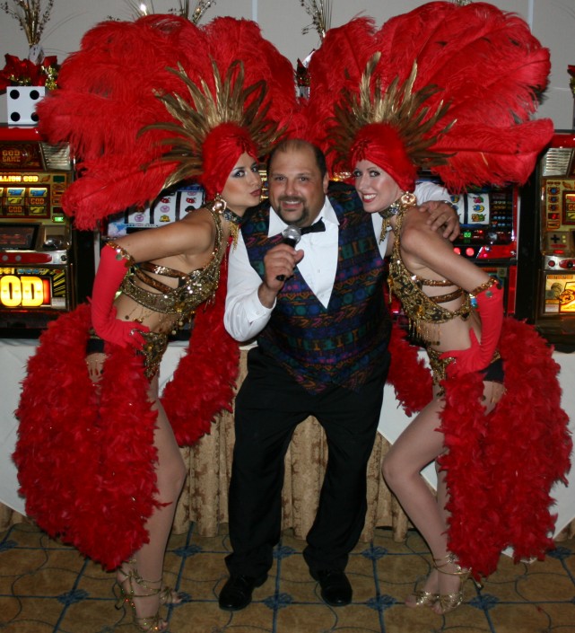 Vegas showgirls in gold and red, entertainer