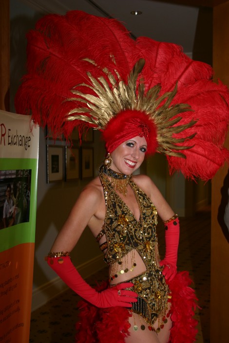 Vegas showgirl in red and gold